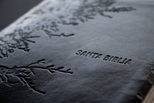 pexels-photo-11736906-11736906 Close-up shot of a Santa Biblia with intricate debossed leather design, capturing religious essence.